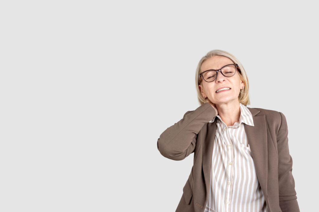 Photo of tired upset mature lady wear business clothes arm neck having pain isolated grey color background.