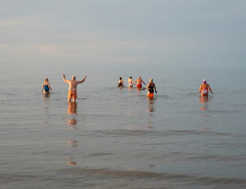 Group of people swimming in the sea