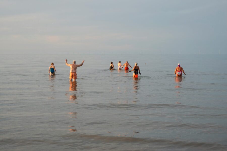 Group of people swimming in the sea