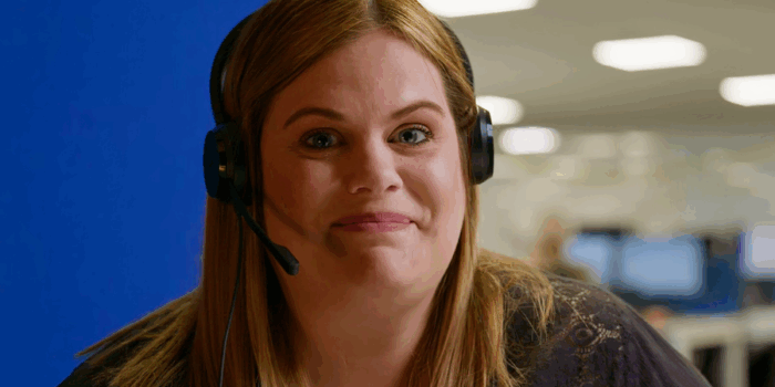 Lady in headset looking at camera