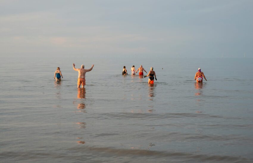 People swimming in sea