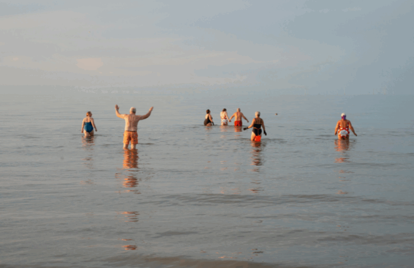 People swimming in sea
