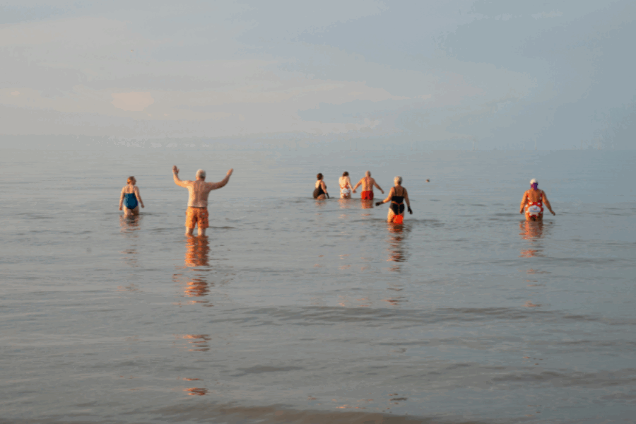 People swimming in sea