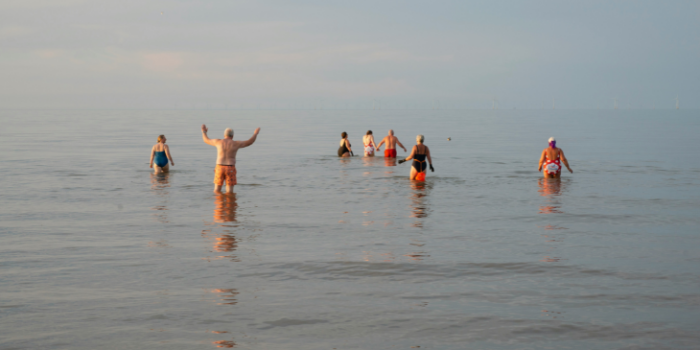 People swimming in sea
